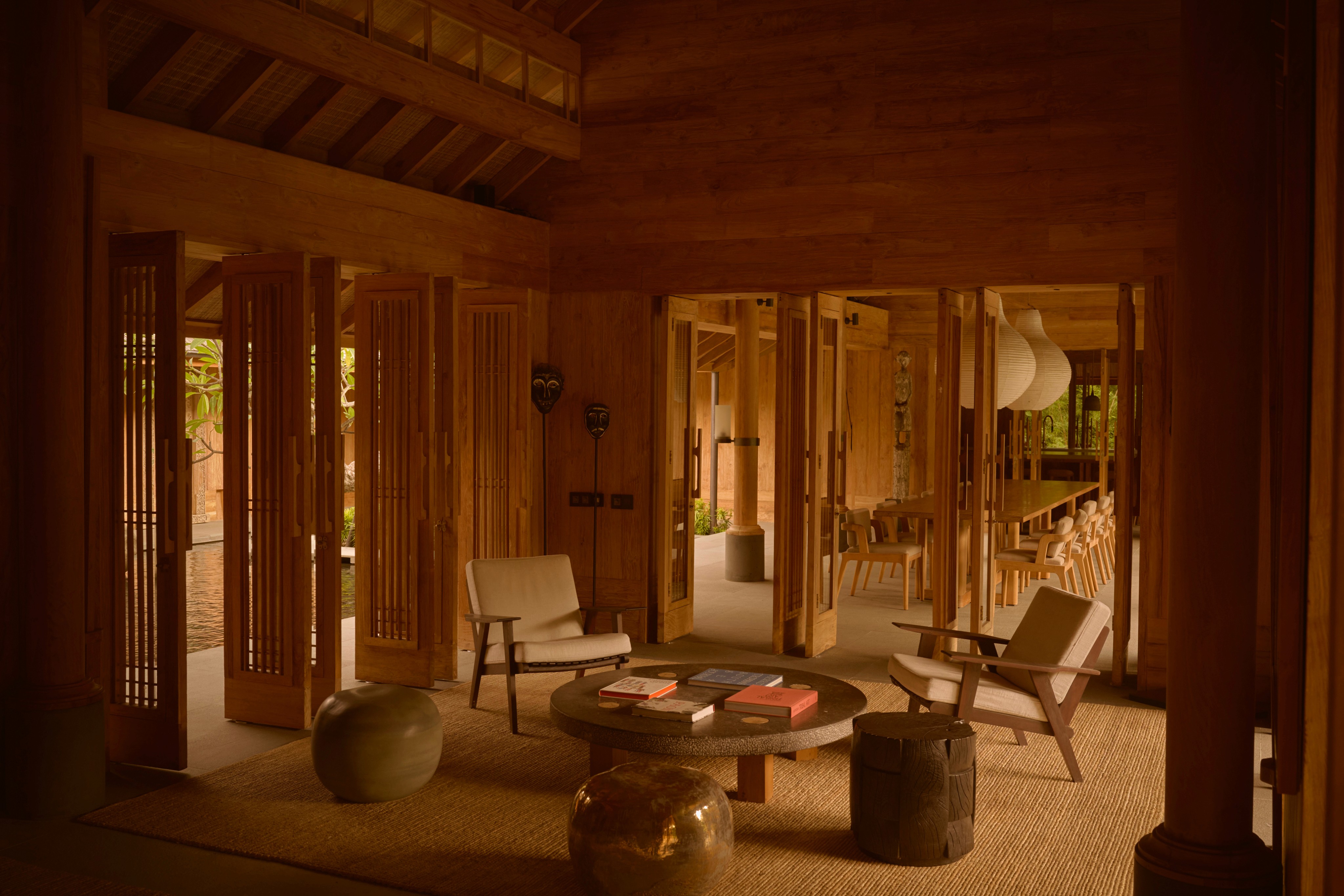 The teak lounge and dining space at Rumah Rubah
